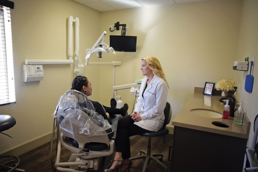 Brooklyn Cambron-Hagerman, DMD consults with a patent who came in for an emergency dentist visit because of a cracked tooth.