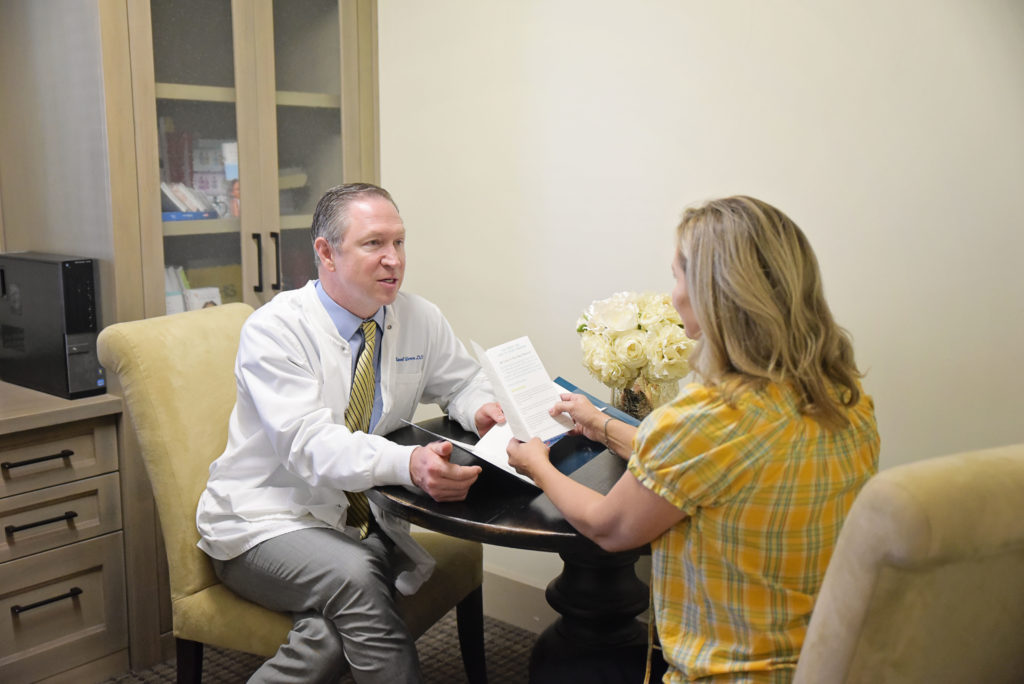 Dr. Warren consults with a patient about sleep apnea treatment options.
