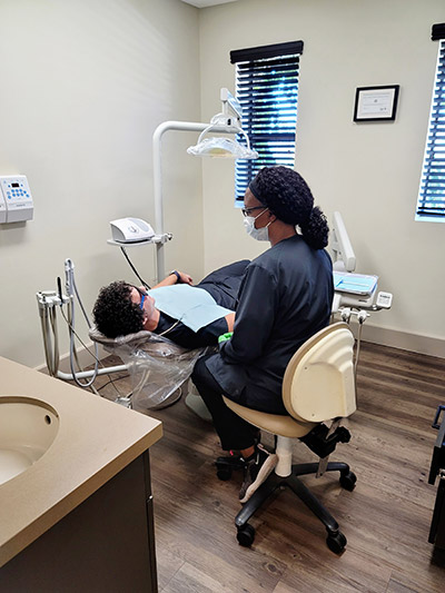 patient talking with hygienist about restorative dentistry